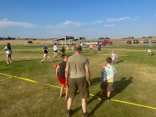 Youth playing dodgeball.