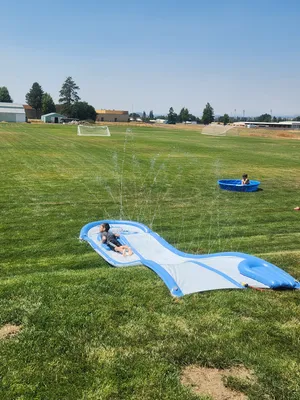 A youth going down a water slide
