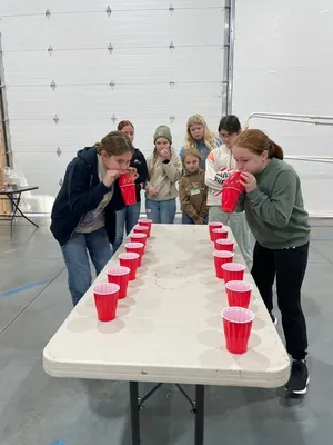Youth playing with balloons and cups