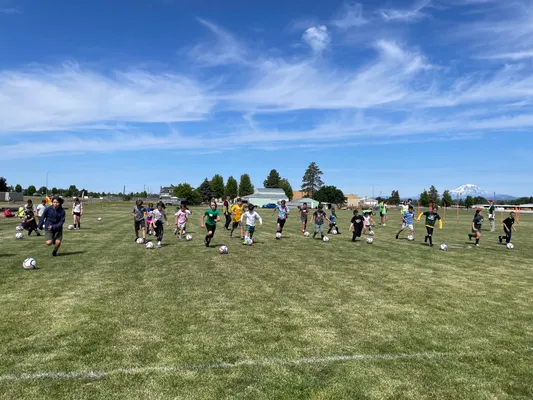 Soccer camp participants enjoying activities